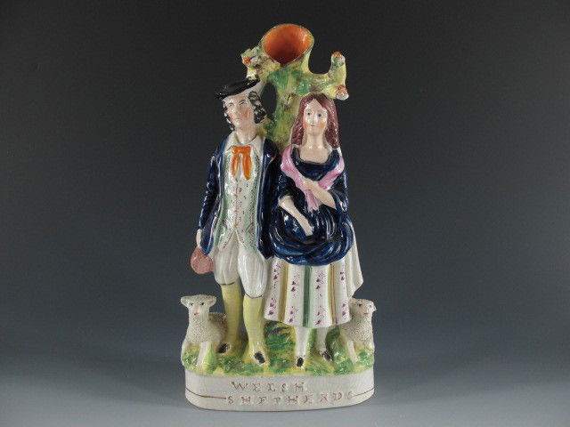 STAFFORDSHIRE SPILL VASE WITH WELSH SHEPHERDS: Painted details and textured lamb, measures 14 x 7 x 3 inches.