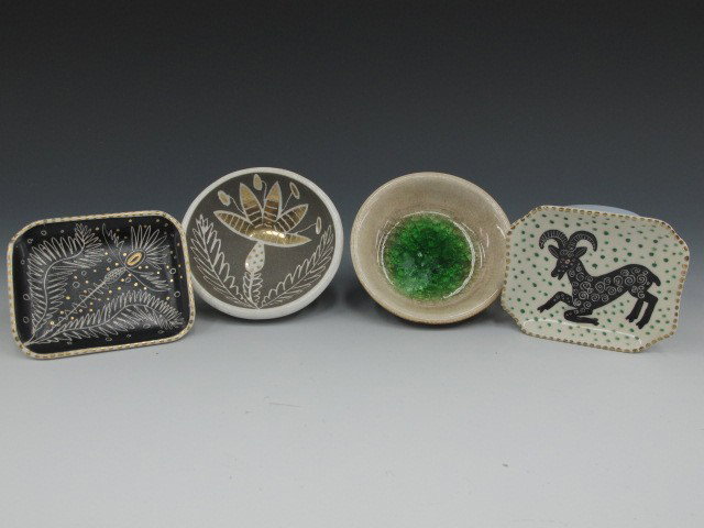 FOUR PIECES OF WAYLANDE GREGORY CERAMICS: One small tray with a goat figure in cream, black, gold and green, 4 x 3.25 inches, signed in gold on the bottom; One small tray in black, cream and gold with a stylized leaves pattern, 4 x 3.25 inche