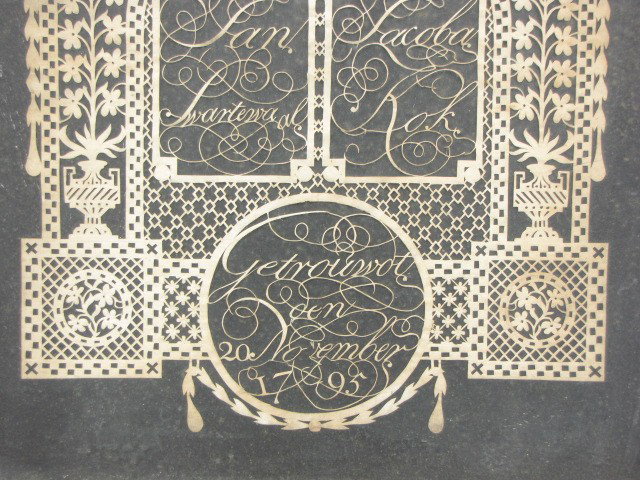 AN 18TH CENTURY SCHERENSCHNITTE: Appears to be a Dutch scherenschnitte marking the wedding of Jan and Jacob on 20 November 1795. Measures 17-1/2 x 13-1/4 inches, in a 23-1/2 x 20 inch frame.