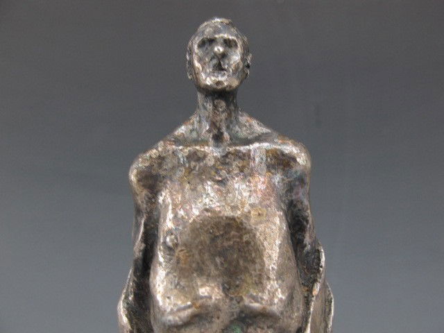 A LEONARD BASKIN (ATTR) BRONZE SCULPTURE: A robed figure with scratch signed signature on the reverse of the base along with '3/6'. Measures 7.5 x 1.25 x 1.5 inches.