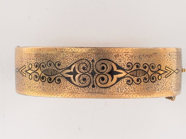 A GOLD TAILLE D EPERGNE ENAMEL BRACELET: A Victorian bracelet, gold with black enamel inside measures 5.5". Weighs 24 grams.