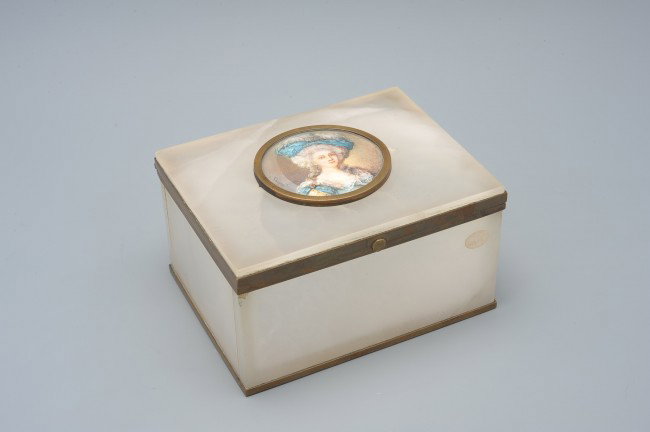 A POLISHED MINERAL CASKET WITH PORTRAIT: A bronze frame box made from a polished opaque mineral (marble?), stamped Made in France, the top is mounted with a round painted miniature portrait signed by the artist lower left, measures 2.75" x 4