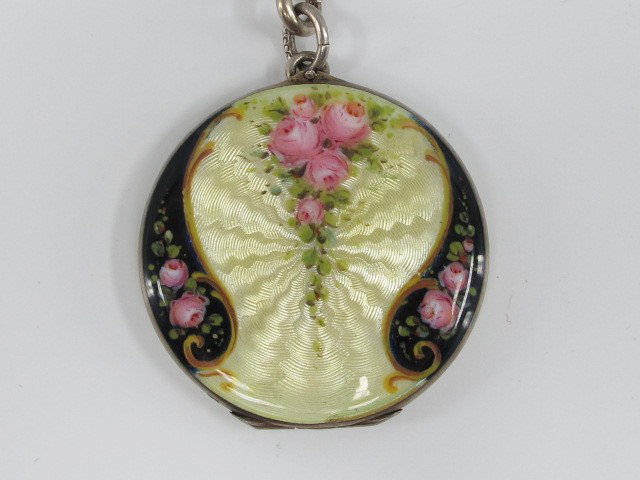 A CIRCA 1920'S GUILLOCHE' ENAMEL NECKLACE: A fine 1.25 inch diameter enameled locket with roses on 24 inch chain with 2.5 inch drop.