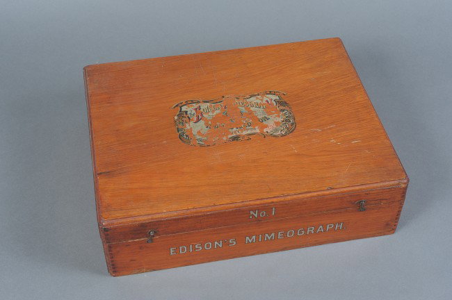 AN EDISON MIMEOGRAPH SET BY A.B. DICK COMPANY: Nice set with frames, roller (with extra), tube of concentrated ink, tube of stencil paper. Dovetail case, remnant decal to top of lid, mostly intact to front. Hook closures.