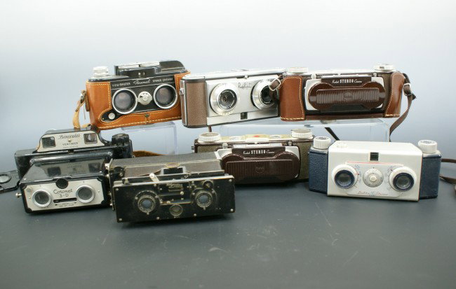 SEVEN STEREO CAMERAS, KODAK, DELTA, VIEW MASTER: Includes two Kodak Stereo Cameras, Delta Stereo with leather case, and View-Master Personal Stereo Camera with leather case and strap; a Coronet 3-D with very old vinyl bag; a Polyscop with shoulder c