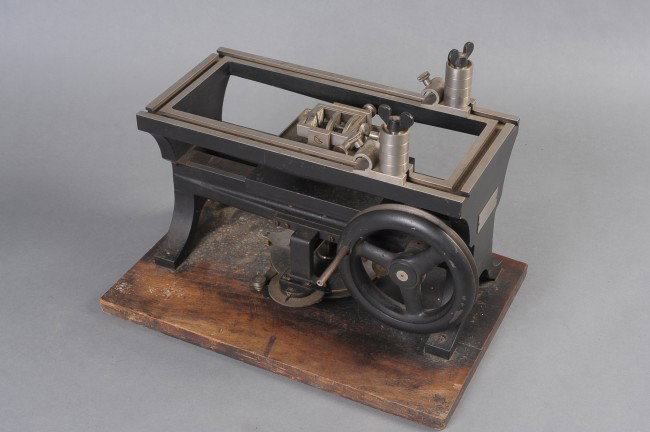 A BAUSCH & LOMB DERMATOME MACHINE NO. 8067: Dermatome machine with Bausch & Lomb plaque applied to side, number 8067; patent dated May 19, 1903. Mounted on wood base. Measures 13 x 18 x 12 inches.