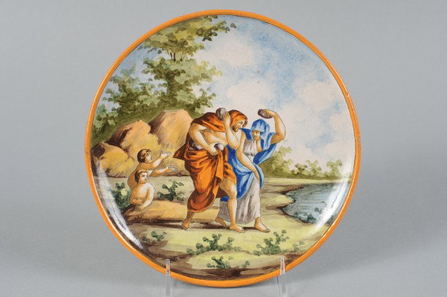 AN ITALIAN FAIENCE PLATE: Unmarked, measures 9" in diameter.