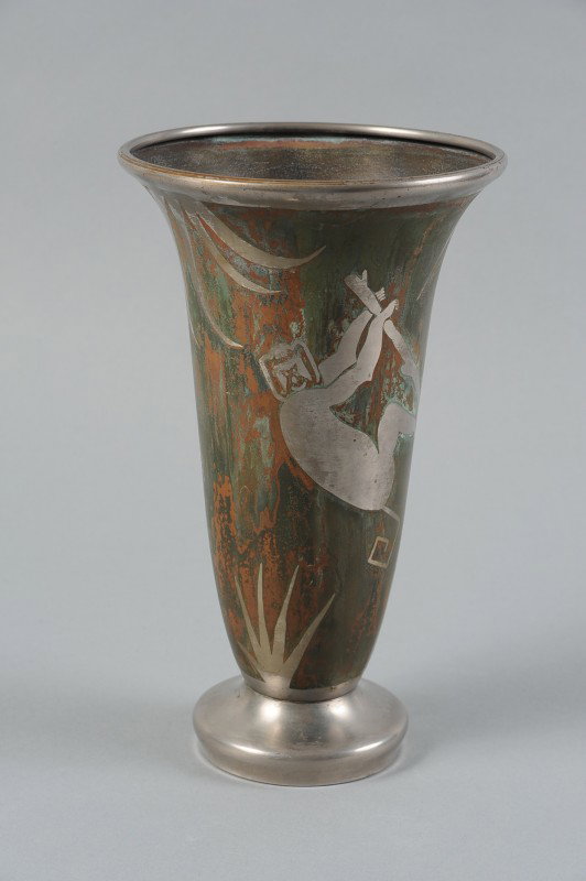A FRENCH ART DECO MIXED METALS VASE, JACQUES DOUAU: A nickel and bronze vase with flaring rim, early 20th Century, signed george within the design and further signed on the vase as shown. Measures 10.25" x 6.25".