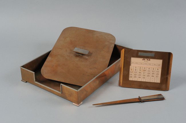 SILVERCREST FOUR PIECE DESK SET OF BRONZE AND SILVER: An Art Deco desk set, signed on the calendar only. Tray measures 14" x 10", lid measures 13" x 9", calendar is 5.5" x 7" and letter opener is 9.5" x 1.25".
