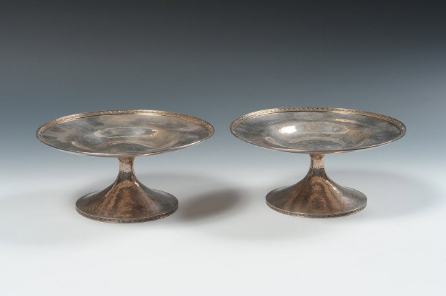 PAIR STERLING TAZZA FOR MARCUS & CO.: A pair of hammered silver tazza with Roman Key borders. Engraved initials, each measures 3.75" x 8 inches, total weight for both 28 ounces.