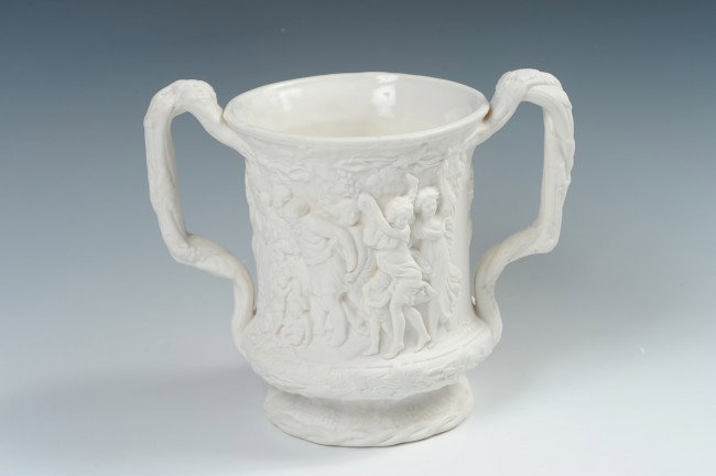 A CHARLES MEIGH PARIAN LOVING CUP: With classical scenes in very high relief and of quality modeling. Measures 6.75 x 8 inches.