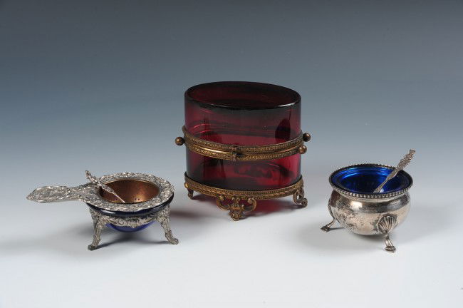 THREE GLASS VICTORIAN PIECES: Lot includes: A cobalt blue salt cellar in a sterling base with a silver spoon, measures 1.5 x 2.25 inches; A cobalt blue glass cup in a metal base with a metal and brass strainer and sterling spoon,