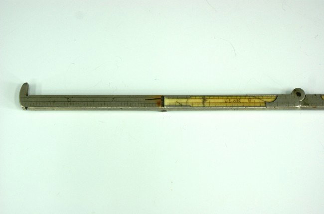 E.M. CHAPIN 12 INCH FOLDING RULER WITH IVORY: Marked 'E.M. Chapin, No. 78,' to ivory face on one side, engraved 'Cal. Turner' and 'Chattanooga' on nickel-silver edge. PLEASE NOTE: No shipping outside the USA for any ivory.