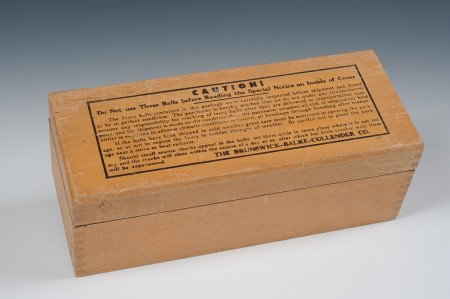 SET OF VINTAGE BRUNSWICK IVORY BILLIARD BALLS: Three carved ivory billiard balls by the Brunswick-Balke-Collender Co., one with a stamped '8.' In original dovetailed shipping box with descriptive decal inside lid. Bottom of box marked '2-3/8 No. 1