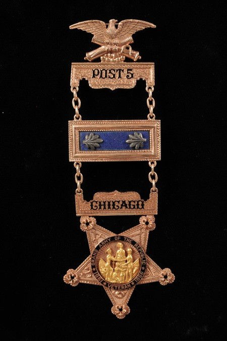 GOLD GAR POST 5 PAST VICE COMMANDER MEDAL: A remarkable multi-piece gold medal / badge, with eagle sitting atop crossed cannons and balls pinback clasp, hinge connected to gold bar with black enamel 'Post 5,' chain connected to a gold miniatur