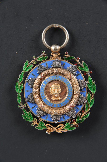 CUBAN ORDER OF CARLOS DE CESPEDES, KNIGHT CLASS: Die struck multi-piece, double-sided, enameled. Obverse with bust of de Cespedes and 1868 date applied to blue enamel base with laurel and oak leaf border. Reverse with similar application, only with 