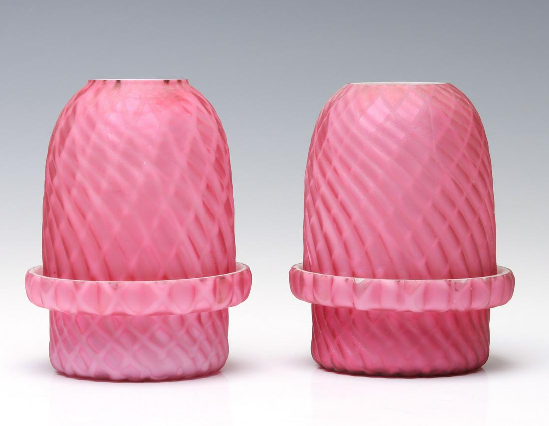 TWO 19C. RED MOTHER OF PEARL AIR TRAP FAIRY LAMPS: The 19th century Victorian art glass fairy lamps feature art glass lamp cup with inserts as shown. Each measures 5 x 3.75 inches. We happily provide seamless in-house packing and shipping services on 