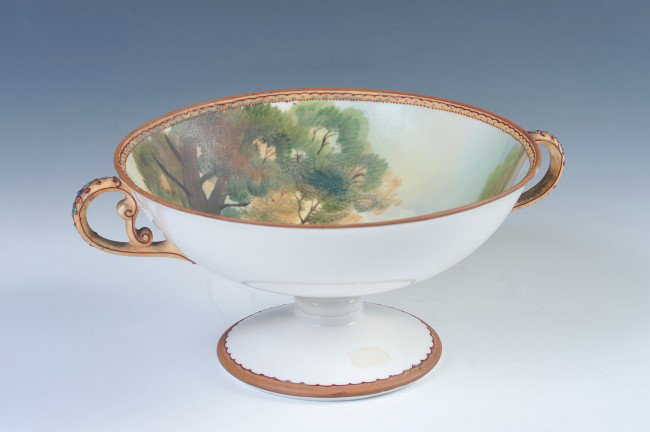 NORITAKE NIPPON COMPOTE WITH LANDSCAPE: Hand-painted interior landscape and moriage beaded trim highlights, green wreath mark, measures 4 x 9 inches.