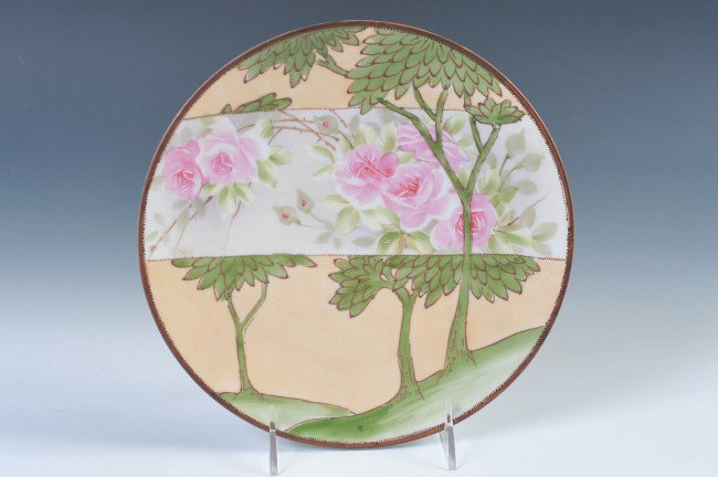 A NORITAKE NIPPON HANGING PLAQUE WITH MORIAGE: A good Nippon plaque made to hang, unusual design highlighted with moriage and beading, measures 9".