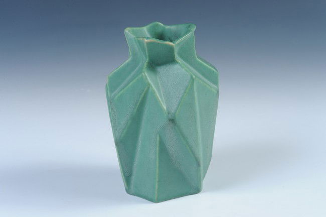 A MUNCIE POTTERY RUBA ROMBIC VASE: A green matte glazed example, designed by Reuben Haley for Muncie Pottery, Indiana (1919-1939), measures 6" x 4".