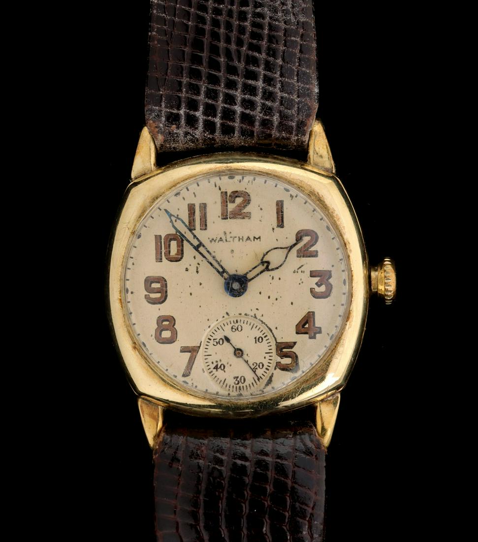 AN EARLY 20TH C. WALTHAM 14K GOLD MEN'S WATCH: The cushion form gent's wrist watch with luminous dial. Measures 1.5 x 1.25 inches with a total weight of 26.5 grams. We happily provide seamless in-house packing and shipping services on nearly every