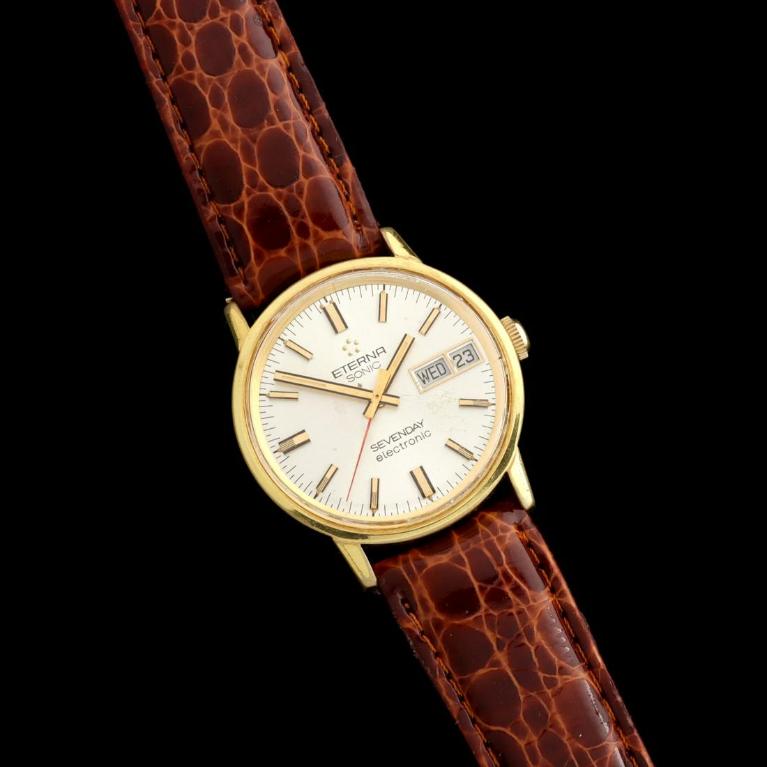 ETERNA SONIC DAY DATE MEN'S WRIST WATCH: The 'SEVENDAY electronic' watch made under Bulova's Accutron patent is housed in a gold top case with stainless back. We happily provide seamless in-house packing and shipping services on nearly every