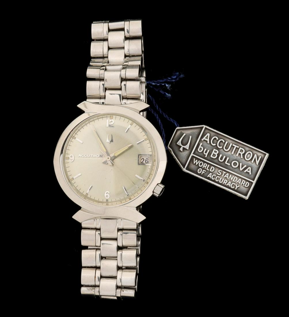 A GENT'S BULOVA 'BOWTIE' ACCUTRON WATCH IN BOX: The stainless steel 'Bowtie' case watch in the original box with pamphlet and tag. Wrist circumference 6.75 inches. We happily provide seamless in-house packing and shipping services on nearly everyth