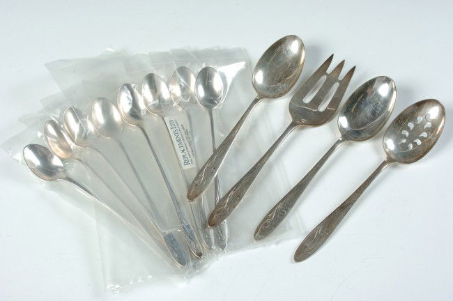 TOWLE AWAKENING STERLING SILVER FLATWARE: A 12 piece set of Towle flatware in the Awakening pattern. Total weight of 18.7 oz. Set includes eight tea spoons 7.75", one cold meat fork 9.25", one slotted spoon 8.5" and two serving spoons 8.5".