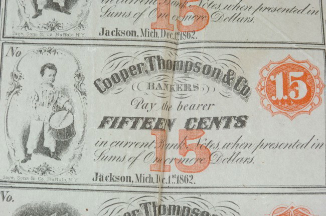 MICHIGAN 1862 UNCUT CURRENCY SHEET, COOPER, THOMPSON & : Uncut single-sided sheet of 24 Cooper, Thompson & Co. Bankers currency, 1862, Jackson, Michigan; eight 10 cents with justice; six 12 cents with George Washington; six 15 cents with drummer boy; four 2
