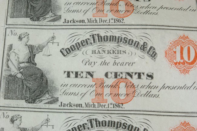 MICHIGAN 1862 UNCUT CURRENCY SHEET, COOPER, THOMPSON & : Uncut single-sided sheet of 24 Cooper, Thompson & Co. Bankers currency; eight 10 cents with justice; six 12 cents with George Washington; six 15 cents with drummer boy; four 20 cents with woman with h