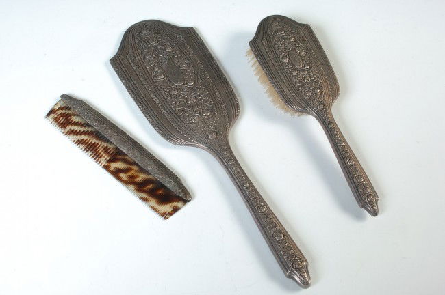 A STERLING DRESSER SET WITH MIRROR, BRUSH & COMB: Comb marked 'sterling 94' in a corner, with tortoise shell style teeth, 7.25 x 1.75 inches; same pattern brush with engraved monogram, RW&S mark and 'sterling 94,' 10 x 3 inches; also a hand mirror, m