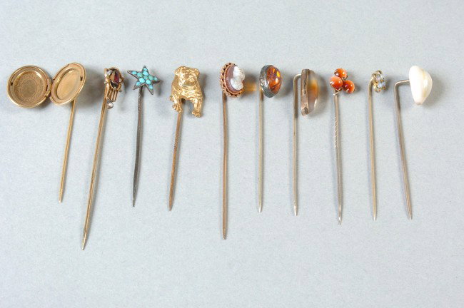 TEN ANTIQUE VICTORIAN STICKPINS: Includes a gilt bulldog, cameo, inset turquoise star, locket and other designs with inset stones.