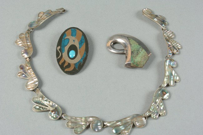 GROUP OF MEXICAN STERLING SILVER JEWELRY: Includes an inlaid Abalone on sterling necklace, 16 inches, marked 'EH, Taxco 950.' A brooch, 2.25 x 1.25 inch oval, marked 'Piedra Negra, sterling, AG, Taxco, T321.' And another brooch, marked 'Tedeo