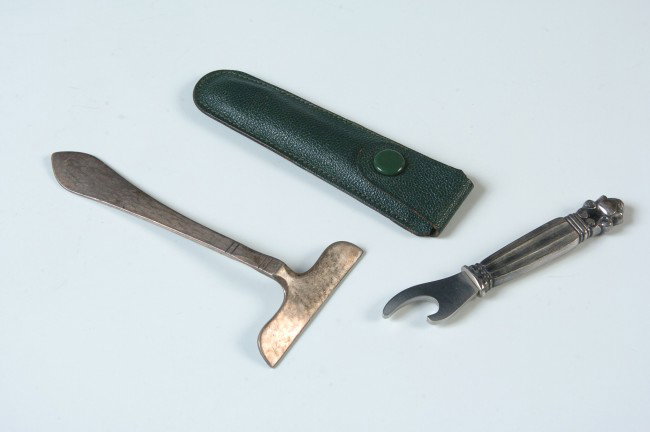 TWO PIECES OF GEORG JENSEN STERLING: Includes an Acorn pattern bottle opener, 3.25 inches, 15 grams with steel opener end;and a hammered 'sterling' marked food pusher, weighs approximately 16 grams.