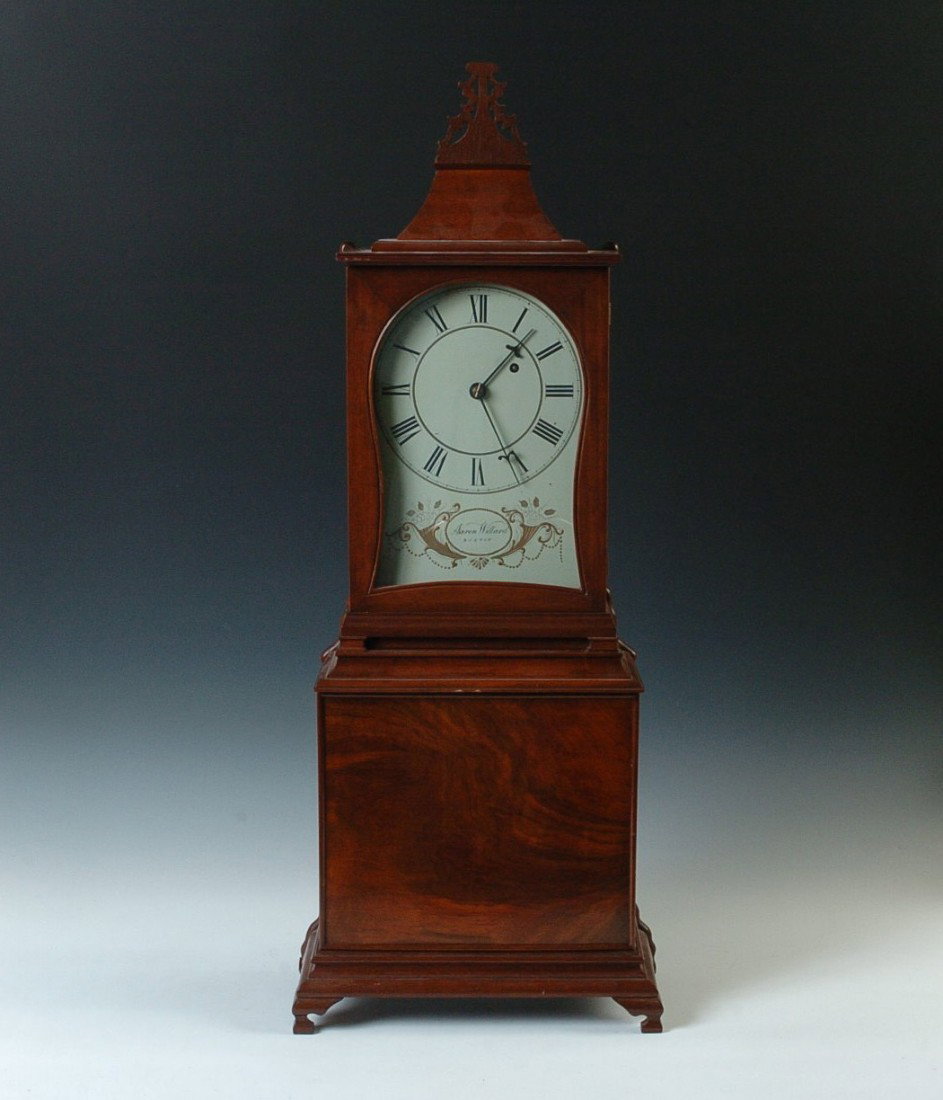 REPLICA OF AN AARON WILLARD CLOCK: An accurate copy of Aaron Willard Massachusetts shelf clock with banjo style movement and weight configuration, nice figured mahogany case, measures 33.25 x 6.25 x 13.25 inches overall. Good running c