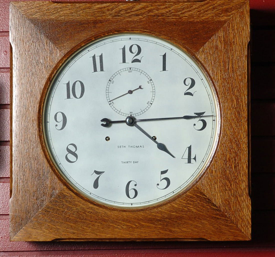 A SETH THOMAS 'HUDSON' GALLERY CLOCK: 30 day, 19 x 19 x 5 inch oak case, dial repainted by Don Sharp.