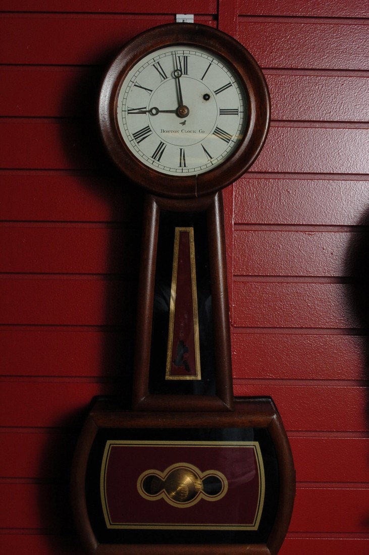 A NICE 19TH C. BOSTON CLOCK CO BANJO CLOCK: Signed Boston Clock Co on the original untouched 7 7/8 inch dial and on the brass movement. Original hands, original paint on the throat glass (f, original glass on lower door repainted, apparently th