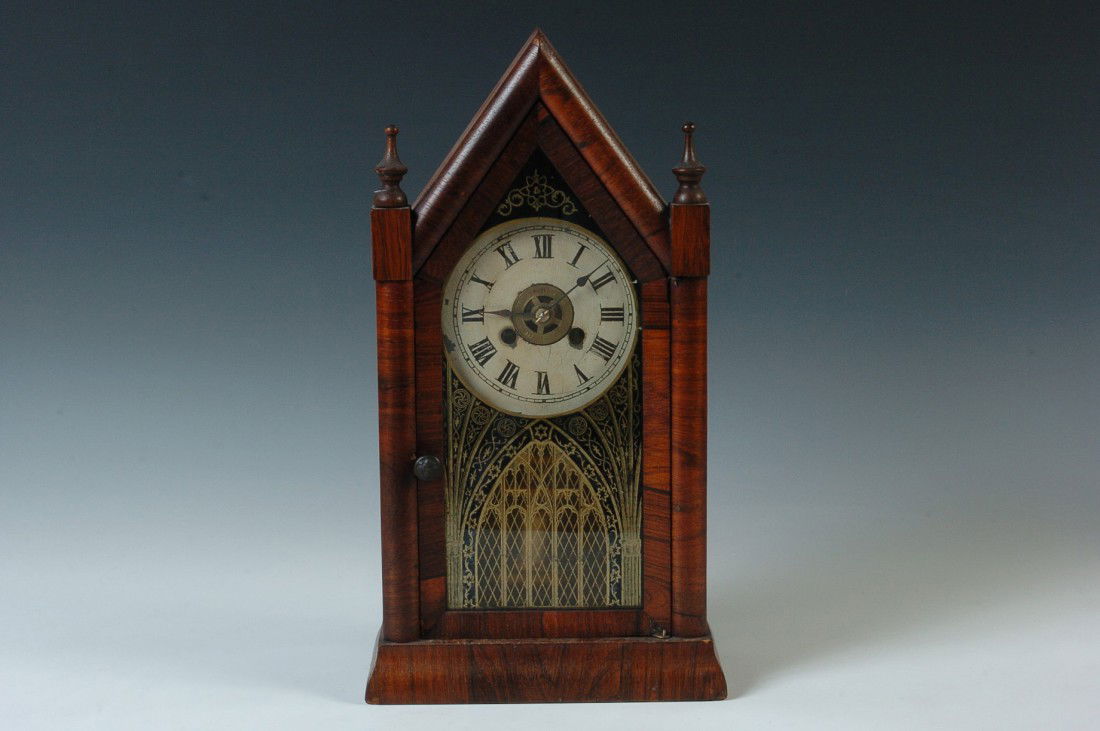 A JEROME & CO STEEPLE CLOCK: Nice little steeple clock with original gothic door glass painting, orig dial, old orig finish, barrel pendulum, good inside label, diminutive size at 15 x 8 inches, good running condition. Running co