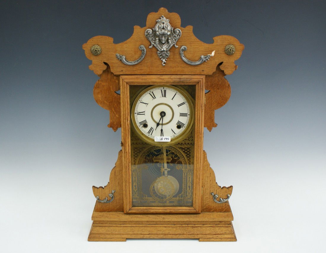 A SETH THOMAS METAL SERIES KITCHEN CLOCK: 22.5 x 15 x 4.5 inches overall.