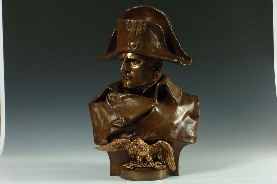 RENZO COLOMBO (1856-1885) BUST OF NAPOLEON, 22 INCHES: Bronze bust with reddish brown patina and a dore eagle figure, signed on the right hand shoulder, the larger size at 22 x 15 x 10 inches overall.