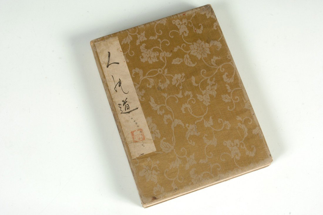 JAPANESE SHUNGA ALBUM 'SPRING PICTURES' EROTICA BOOK: Album of twelve erotic scenes of couples making love. Anonymous (19th-early 20th century). Woodblock prints in ink and color on cloth mounted to rag paper, unsigned but with signed title strip on albu