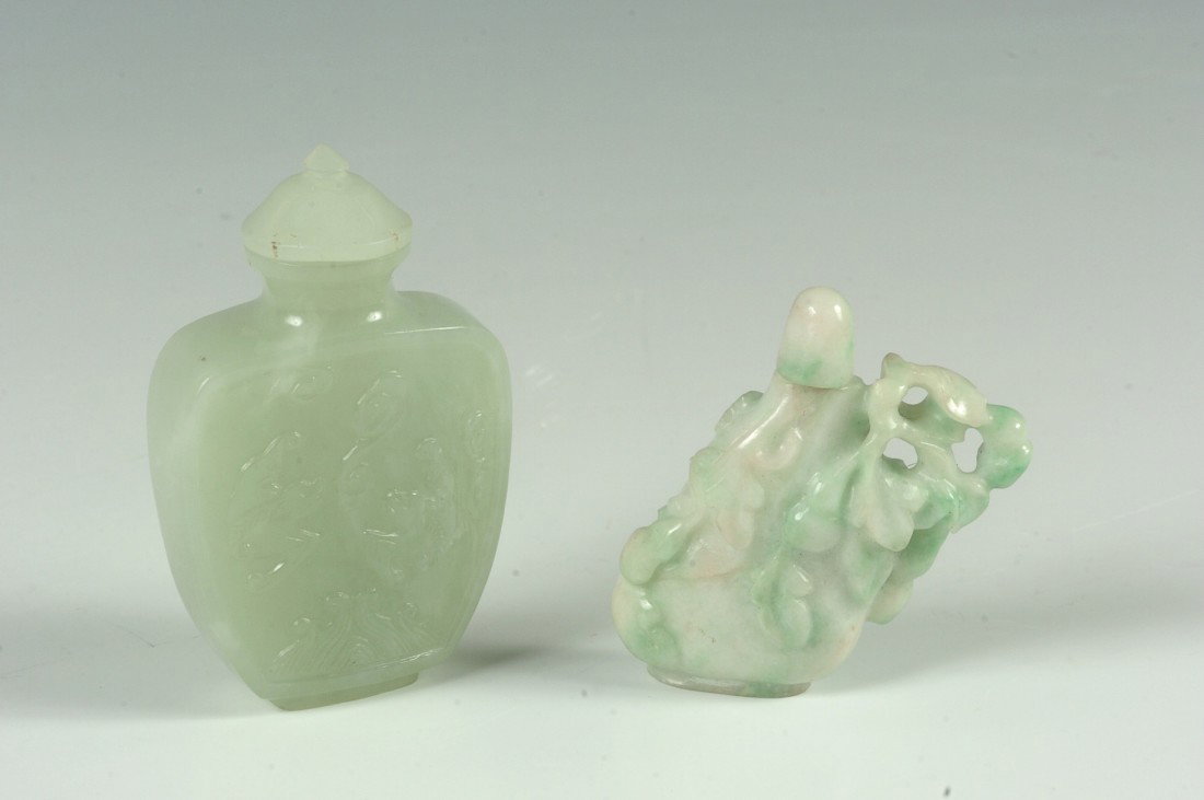 TWO CHINESE CARVED JADE SNUFF BOTTLES: One with nicely carved and openwork florals, stopper and scoop intact, measures 2.25 x 2 inches; and a symmetrical example with carved fish, bats and more. Very neat. Measures approximately 3 x 2 inch