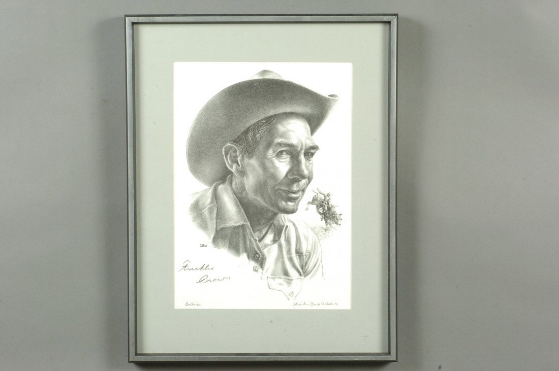 CHARLES BANKS WILSON (1918 - ) 'BULLRIDER,' SIGNED BY F: Hunt #81 titled 'Bullrider,' lower left and pencil signed lower right with a date of '76, an edition of 200. Pencil signed by 'Freckles Brown' above title in lower left corner. Matted and framed with 
