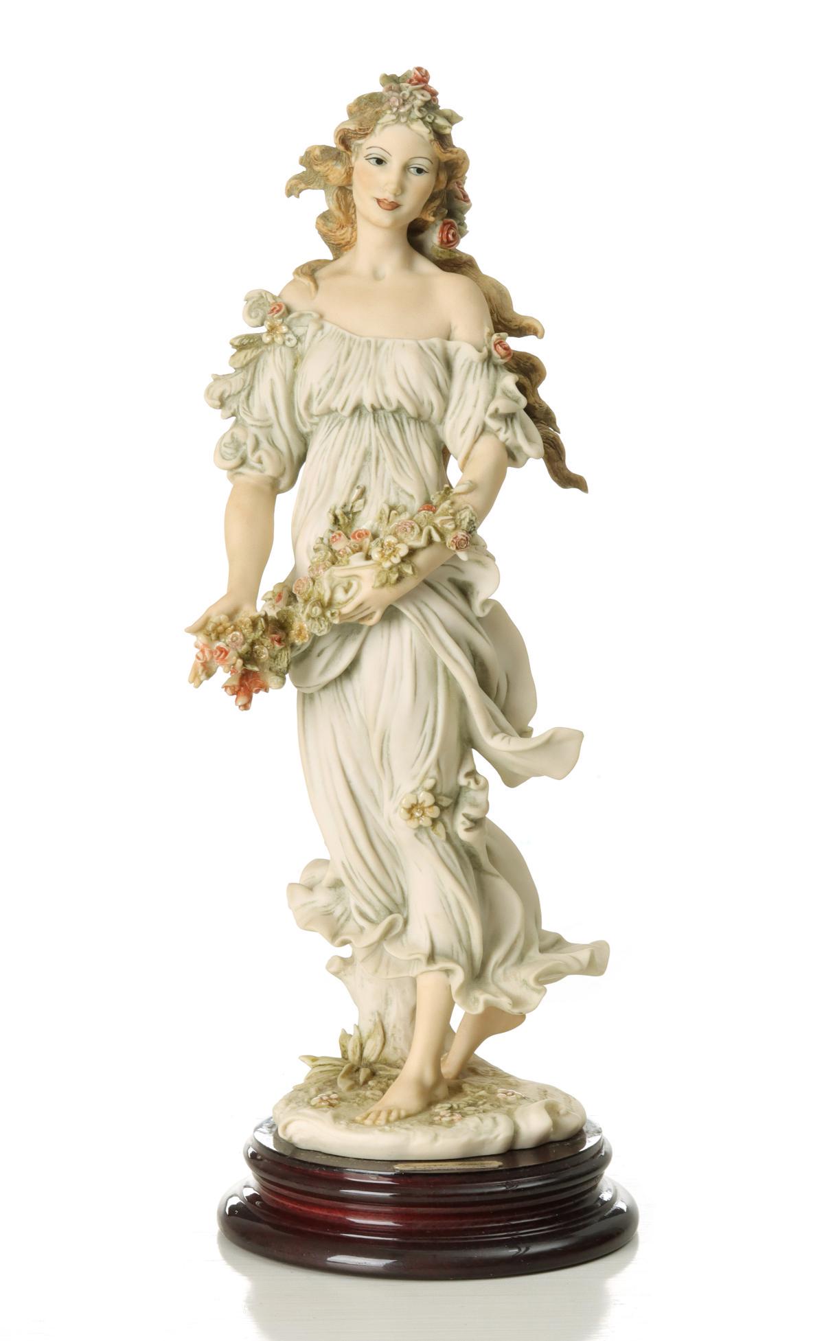 GIUSEPPE ARMANI 'FLORA' FIGURE WITH BOX: The Collector Society figure is signed near the base and dated 1993, with original box, stamped 'G Armani Collector Society 1994.' Measures 14.5 inches.
