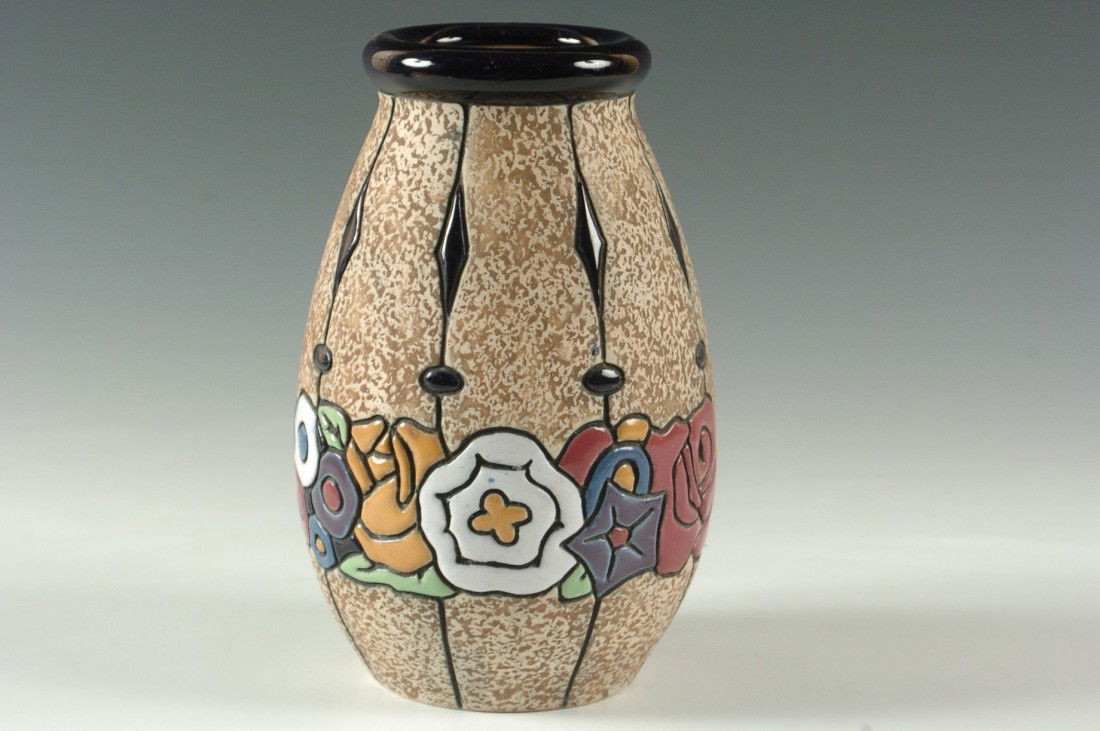 AN AMPHORA CARVED AND ENAMELED VASE: Marked 'Amphora, made in Czechoslovakia.' Measures 7.25 h x 4.5 w inches.