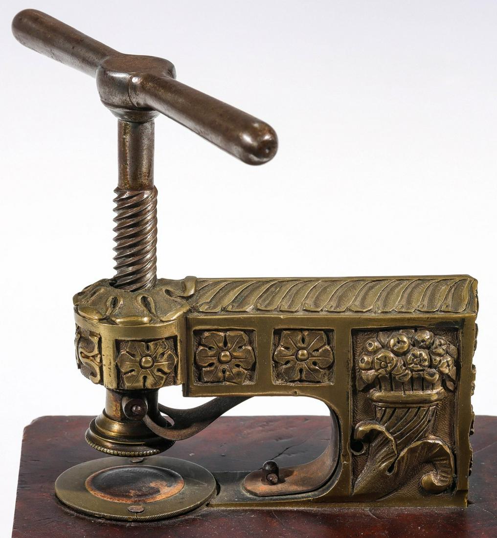 AN ORNATE BRASS PAPER EMBOSSING SEAL CIRCA 1890 (1 of 9)