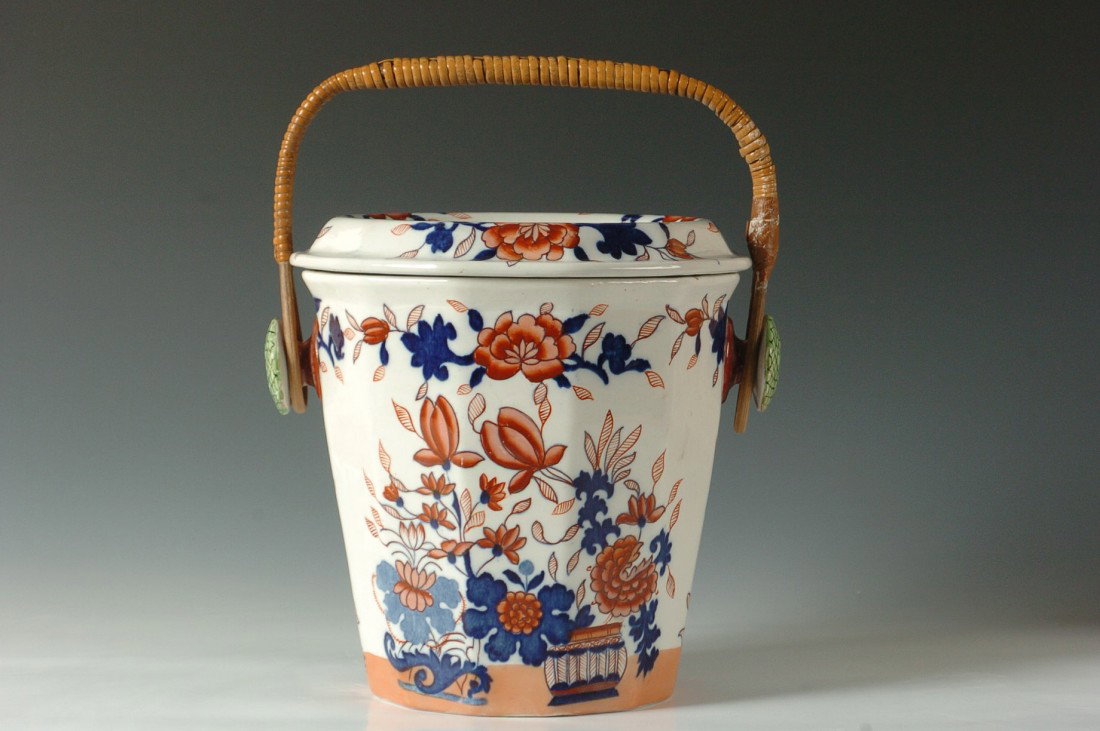 CIRCA 1900 MASON'S IRONSTONE WASTE JAR: With rattan handle and ceramic insert, marked with printed crown and banner, impressed '3' and with pattern number 'C.5244'. Measures 11.5 x 10.5 inches.