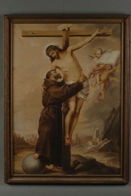 CIRCA 1900 GERMAN OIL ON CANVAS, NAZARENE SCHOOL: Depicts Christ being helped down from the cross by St. Francis, showing stigmata and with his foot upon a globe. The book the angels are holding is a Latin quotation from the gospel of Luke, ch. 14 (s