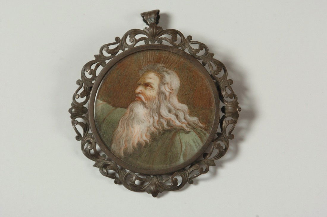 VICTORIAN .800 SILVER PENDANT W/ MOSES PORTRAIT ON IVOR: A filigree frame pendant marked .800 housing a hand painted image on ivory that resembles Moses or the William Blake image of God, measures 2 inches diameter. NO INTERNATIONAL SHIPPING.