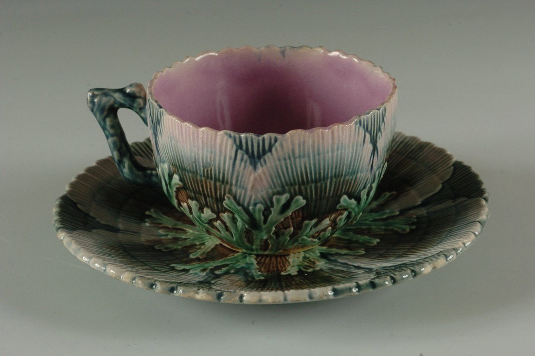 GSH ETRUSCAN SEAWEED MAJOLICA CUP AND SAUCER: Griffen Smith & Hill monogram and Etruscan mark, cup measures 2.25 x 3.5 inches, saucer 6.25 inches.